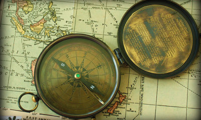 compass on map representing a guide to factoring